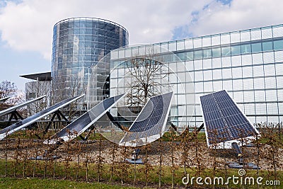 Blue rotating solar panels tilted axis tracker, future innovation energy Stock Photo