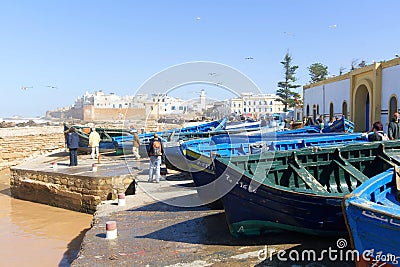 Blue rowing boats hauled onshore Editorial Stock Photo