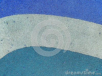 Blue rubber surface anti-traumatic safety tile for workout sports playground in public park or courtyard. The background Stock Photo