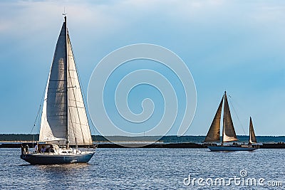 Blue sailboat at river Stock Photo
