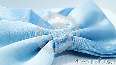 Blue satin bow tie on a white background. Stock Photo