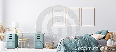 Blue Scandinavian bedroom with three vertical frames in bright design Stock Photo