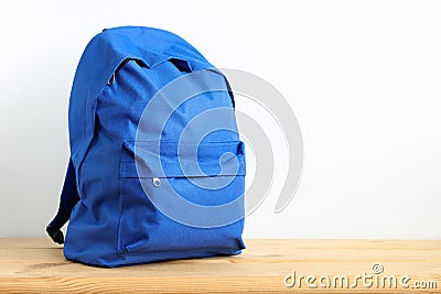 Blue school backpack, sports bag on the table. Stock Photo