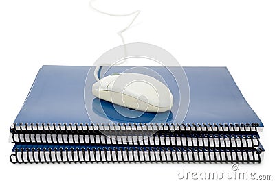 Blue school textbook and computer mouse Stock Photo