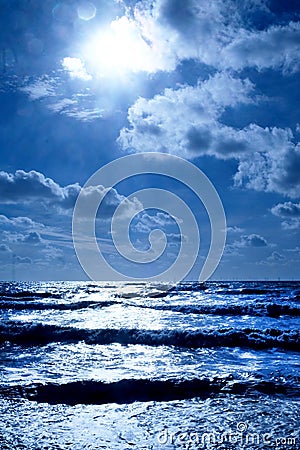A blue sea glistening white Stock Photo