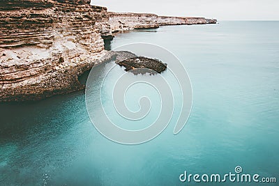 Blue Sea with rocky seaside Landscape Stock Photo