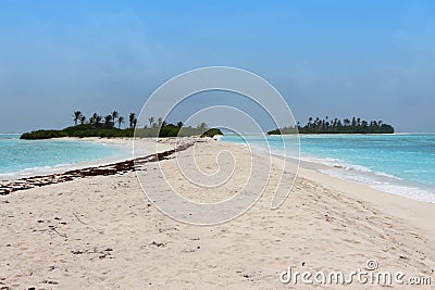 Blue sea with small deserted island Stock Photo