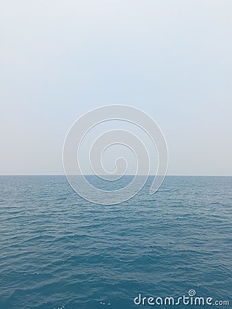 The blue sea is so spacious And the waves dispel boredom Stock Photo