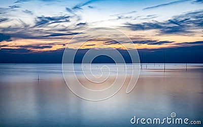 Blue sea of tranquility at twilight Stock Photo