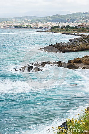 Blue sea waves on a rocky beach, Crete, Greece. Stock Photo