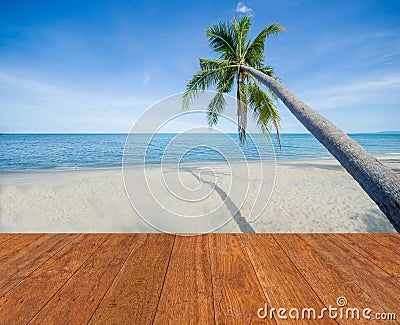 Blue sea, white sand, coconut palm tree and blue sky with wooden bridge walkway in Summer background. Summer beach fresh concept. Stock Photo