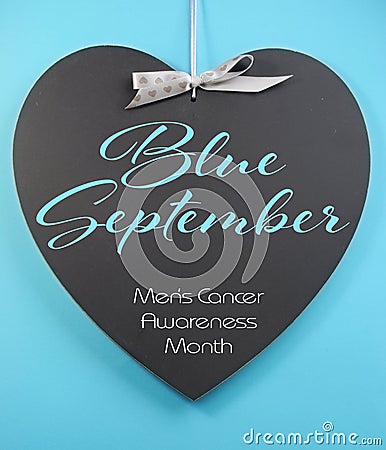 Blue September for mens health awareness month message greeting on heart shape blackboard Stock Photo