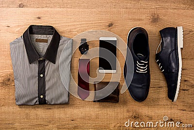 Blue shoes, mobile phone, tie, notecase, clock and shirt Stock Photo