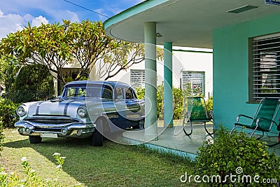 Blue silver american Pontiac vintage car parked under the canopy in the garden in Varadero Cuba - Serie Cuba Reportage Stock Photo