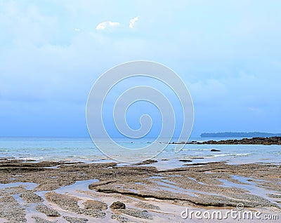 Blue Sky with Clouds and Calm Sea Water at Rocky and Sandy Beach - Natural Background Seascape - Sitapur, Neil Island, Andaman Stock Photo
