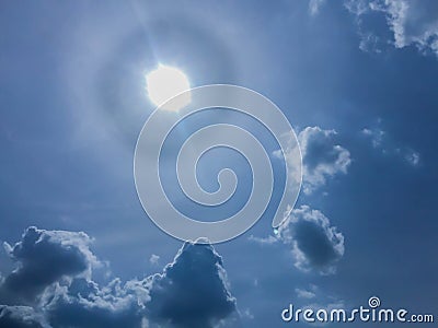 Blue sky with clouds and circle sun Stock Photo