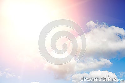 Beautiful blue sky with clouds and sun with rays of light Stock Photo