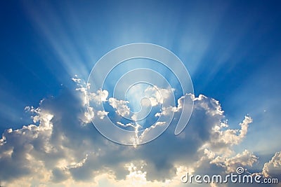 Blue sky & clouds with sun rays Stock Photo