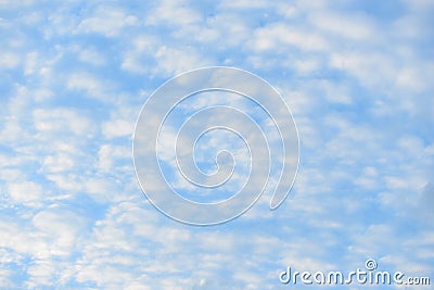 Blue sky with fluffy clouds, close-up background Stock Photo