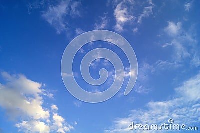 Blue sky with gray swirling clouds Stock Photo