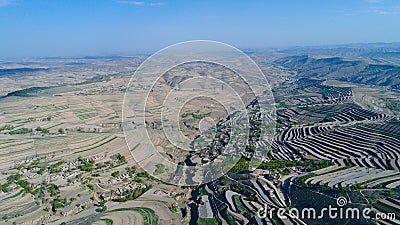 Aerial view of farm field hills, terraced valley with massive agricutlure Stock Photo