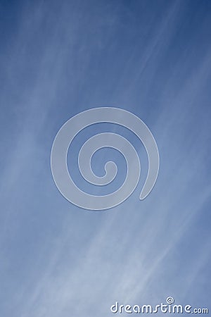 Blue sky with lining seamless clouds vertical version Stock Photo