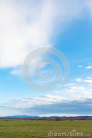 Blue sky over winter agrarian fields in spring Stock Photo