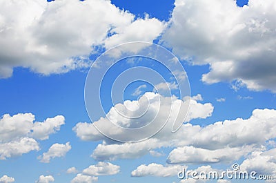 Blue Sky and puffy clouds Stock Photo
