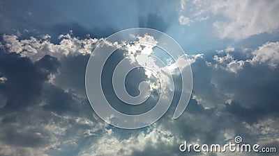 Blue sky, puffy clouds and oh my god a bright light Stock Photo