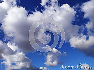 Blue sky with some clouds that fades away in the distance Stock Photo
