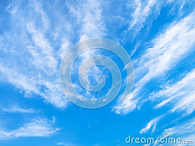 Blue sky with ray shaped spindrift clouds Stock Photo