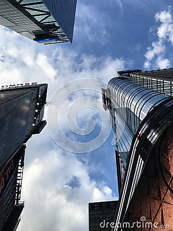 Blue sky white cloud three buildings Newyork New York Timesquare H&M Stock Photo