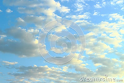 Blue sky and white clouds backlit by the sun Stock Photo