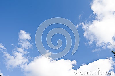 Blue sky with white clouds, it is a bright and sunny day in a warm summer It is a good weather and there is beautiful nature in th Stock Photo