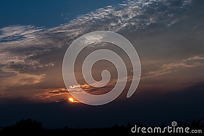 Blue sky with white clouds on sunset. Many little white clouds creating a tranquil weather pattern on the blue background Stock Photo