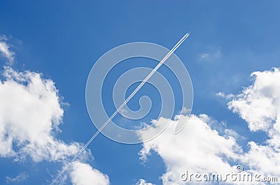 Blue sky. White clouds. Trace of the plane Stock Photo