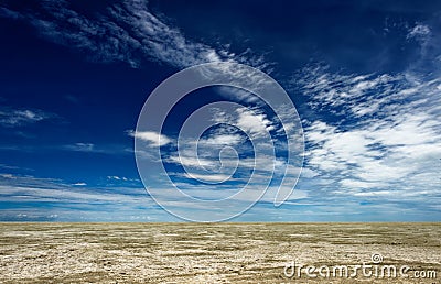 Wispy clouds over plains Stock Photo