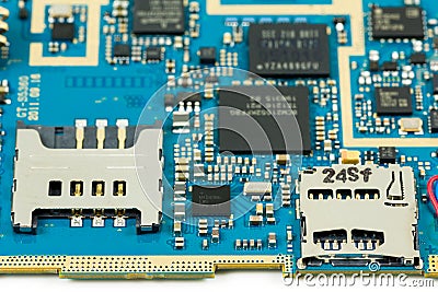 Blue smartphone circuit boardshowing sim card slot and sd card s Stock Photo