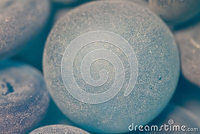 Blue smooth polished glass stones round forms macro Stock Photo