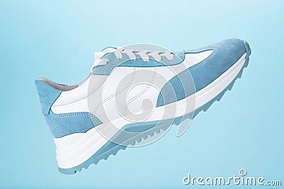 Blue sneaker blue background Stock Photo