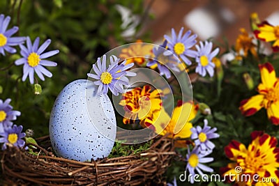 Blue Speckled Egg in Nest Stock Photo