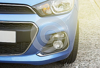 Blue sport car front view, a headlights close-up, toned Stock Photo