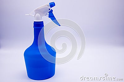 Blue spray bottle on white background Stock Photo