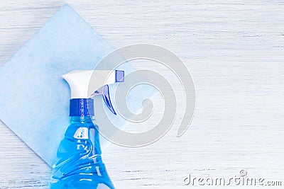 Blue spray for washing glasses lies on a rag Stock Photo