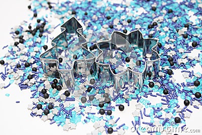 Blue star shaped sugar sprinkles with metal biscuit cutter in advent season Stock Photo