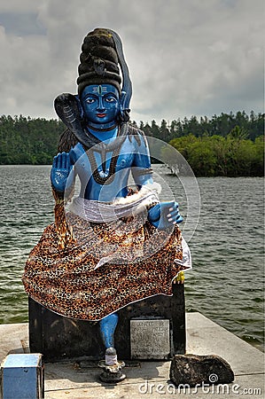 Statue of Hindu God in Shiv Mandir on Mauritius Editorial Stock Photo