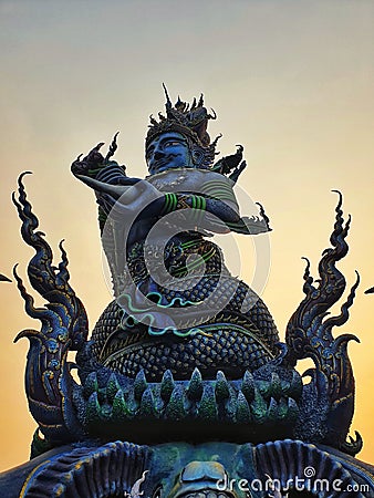 Blue Statue at Rong Sue Ten temple chaing rai in evening Stock Photo