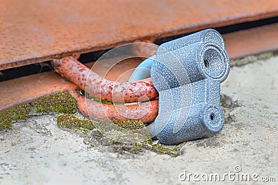 Blue steel padlock closed lies on concrete Stock Photo