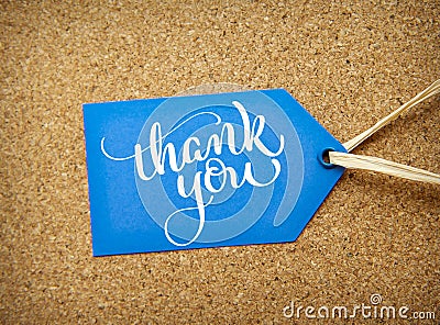 Blue sticker sale on the cork background and text Thank you. Calligraphy lettering hand draw Stock Photo