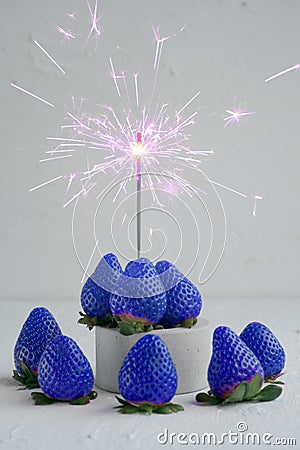 Blue strawberry with flares on a white background Stock Photo